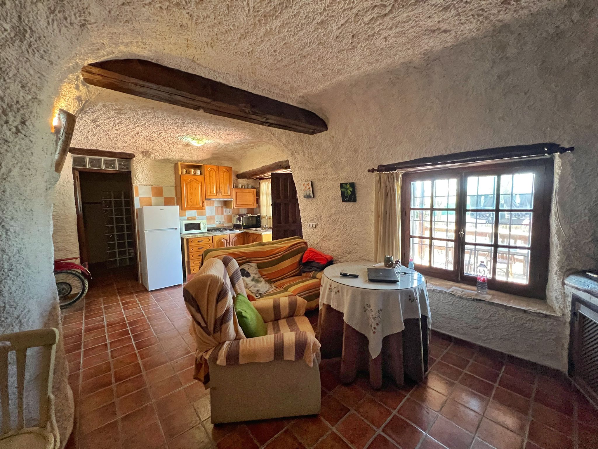 Example photograph of a cave kitchen and living area
